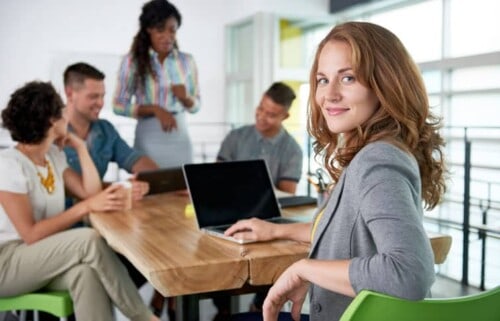 Young woman with computer makes connections with others