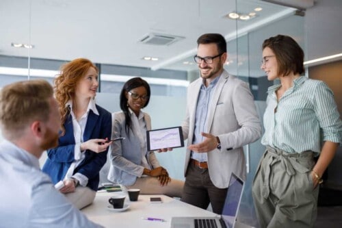 real estate agents and brokers gather for a meeting