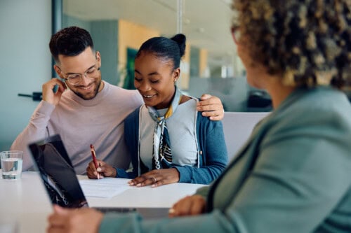 couple looks at real estate loan documents