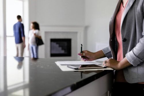 real estate agent looking at contract