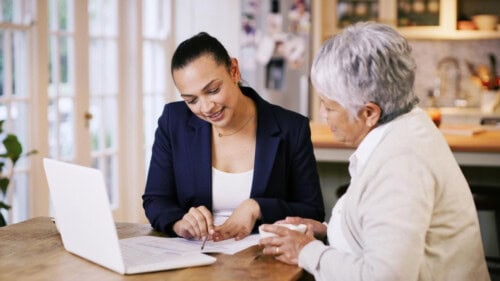 real estate agent shows contract details to buyer - real estate agent benefits