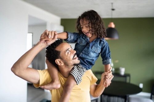 father plays with child at home – best jobs for stay at home dads
