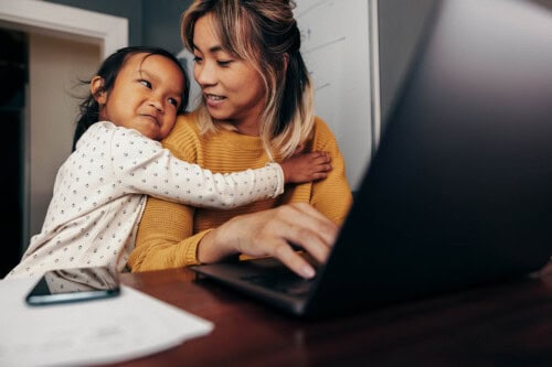 mom works from home with child